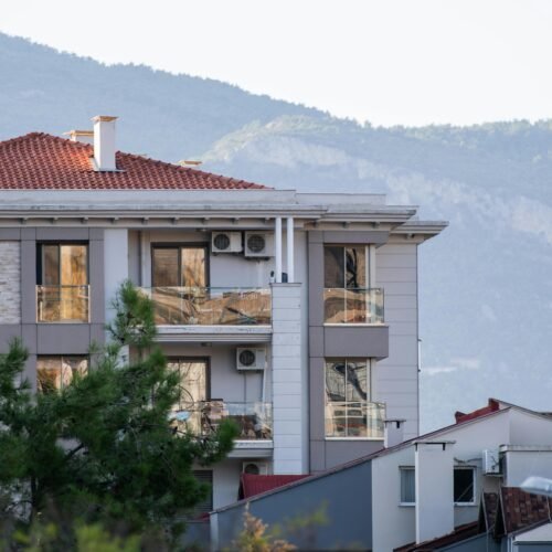 Modern apartment building by HRS Constructions builders number